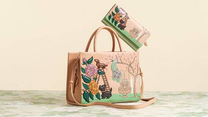 A matching Radley handbag and purse - the design has 2 dogs in a garden