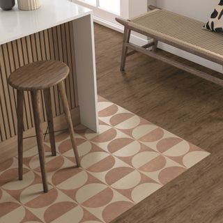 Kitchen with patterned floor tiles under island