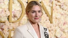 Kate Winslet wears an embroidered white suit at the 82nd Annual Golden Globes held at The Beverly Hilton on January 05, 2025