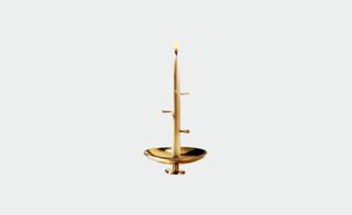 3rd ritual white candle in gold candle holder