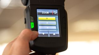 A screen displaying speedlight zoom options