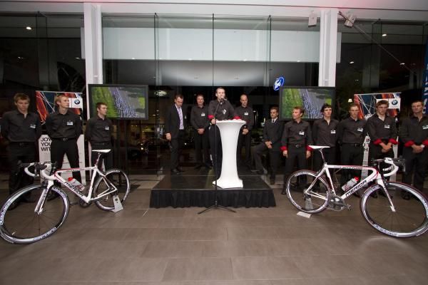 Team owner Chris White addresses those at the launch, with the riders and team management watching on.