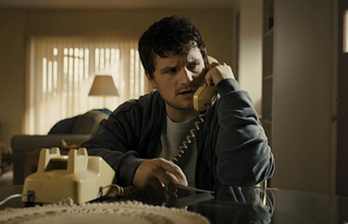 Josh Hutcherson in Five Nights at Freddy's using the telephone