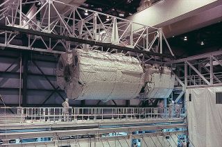 Europe's first Spacelab module is seen being integrated with NASA's space shuttle Columbia at Kennedy Space Center in Florida in 1983.