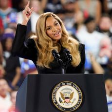 Beyonce wearing a black blazer dress onstage at the kamala harris houston texas rally