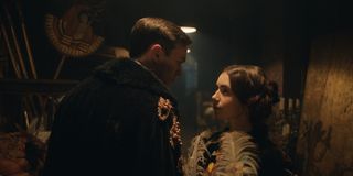 Tolkien Nicholas Hoult and Lily Collins dance in costume in the alley