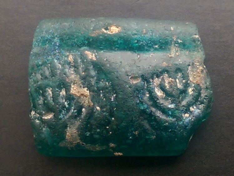 Menorah bracelet fragment.