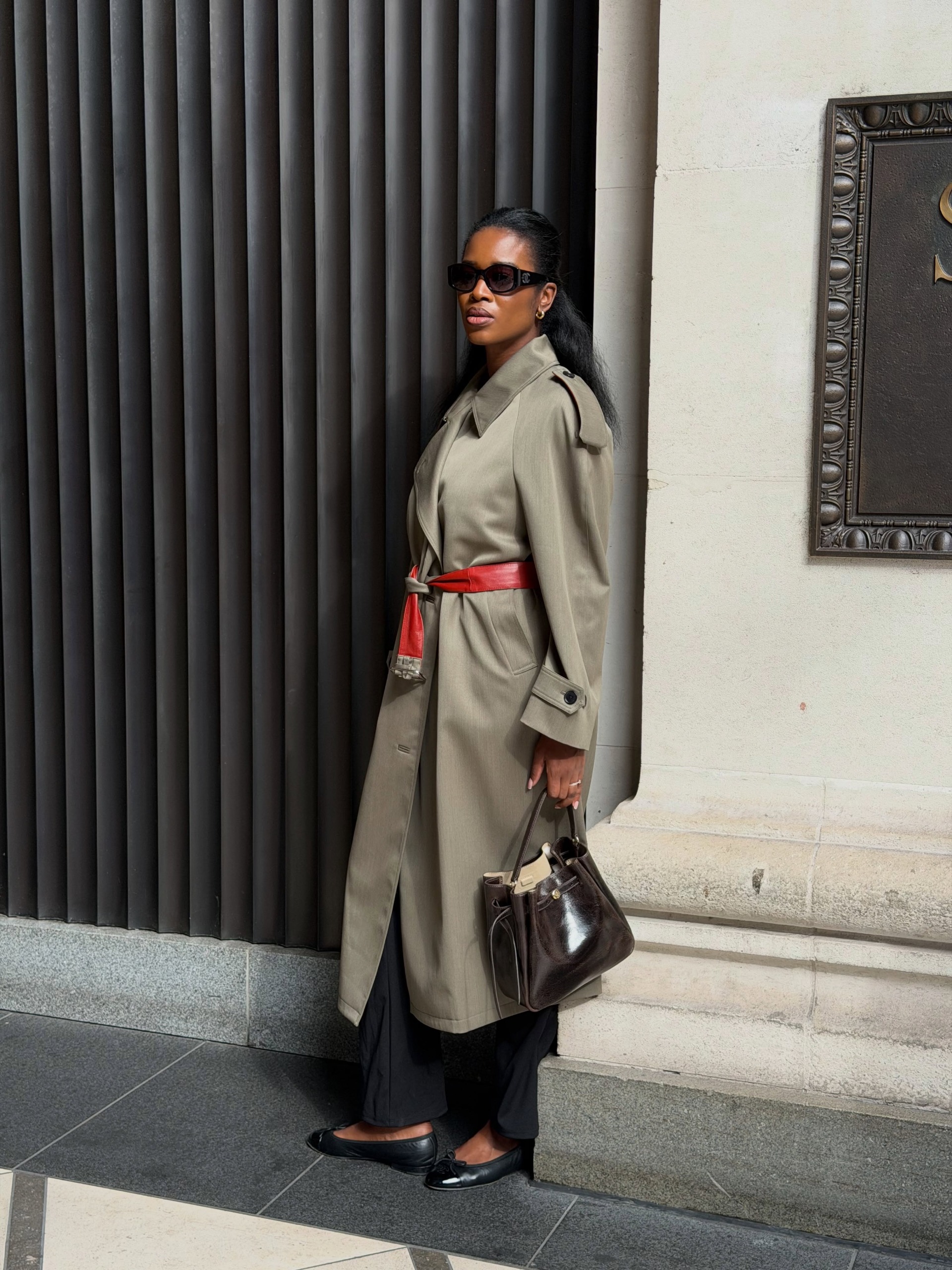@nlmarilyn wearing a trench coat and ballet flats