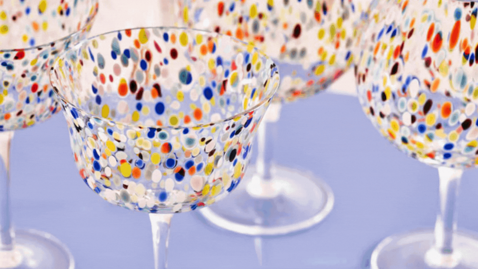a gif showing tables set with confetti glassware, close up of confetti cocktail glasses, and four deep-etched cut out images of multi-colored confetti glassware