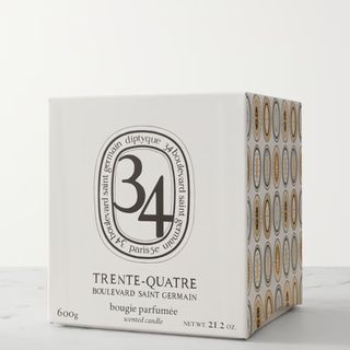 A Diptyque candle in the box