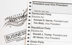 In this photo illustration, an absentee voter mail-in ballot shows the names of the presidential and vice presidential candidates for the November 5 US general election, including Democratic party candidates US Vice President Kamala Harris and her running mate, Minnesota Governor Tim Walz, and Republican party candidate former US President Donald Trump and his running mate, Ohio Senator J.D. Vance.