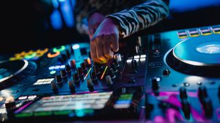 Close up of hands on a DJ controller