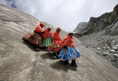 DATE IMPORTED:April 21, 2016Aymara indigenous women practice descending on a glacier at the Huayna Potosi mountain, Bolivia.