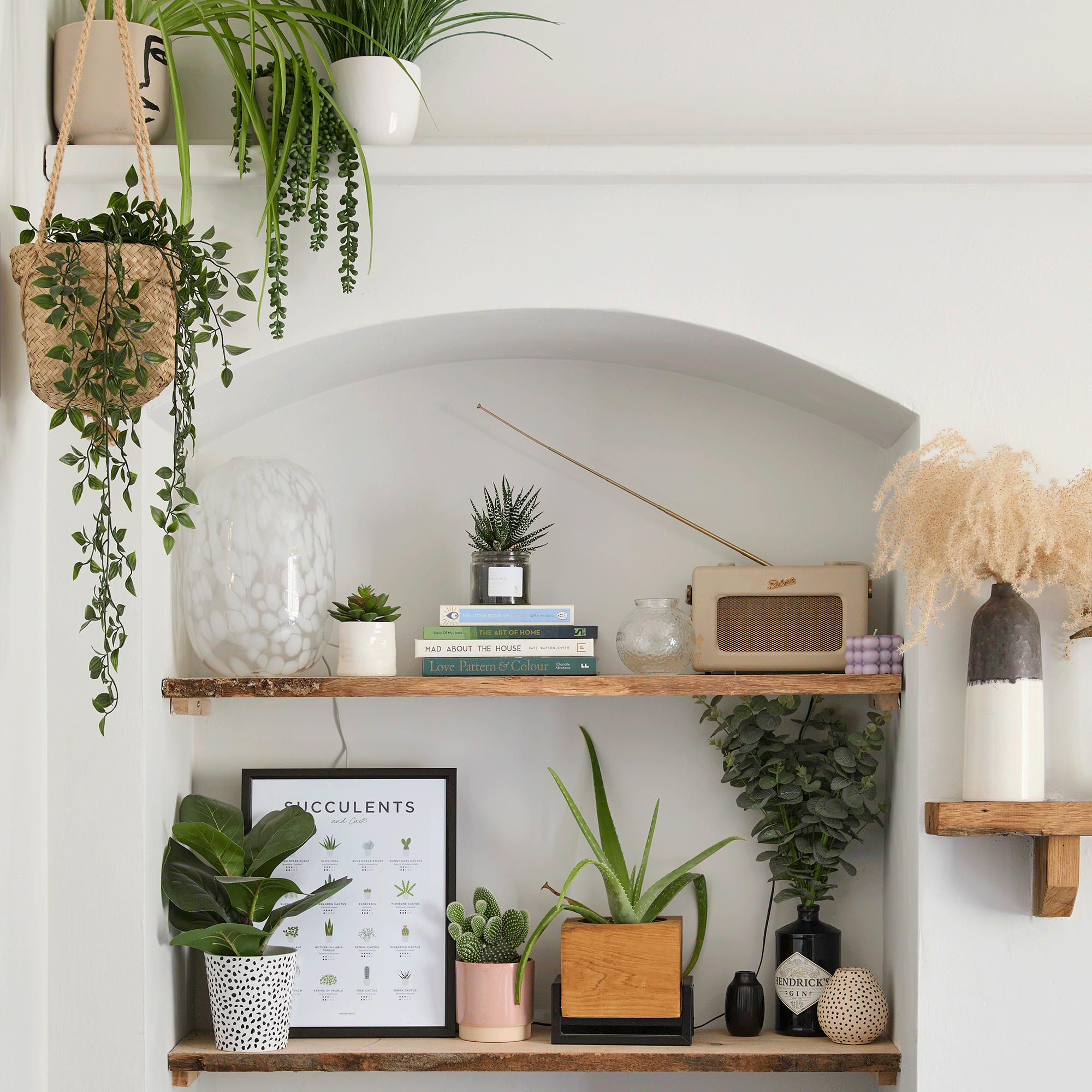 White arch living room with wooden shelves