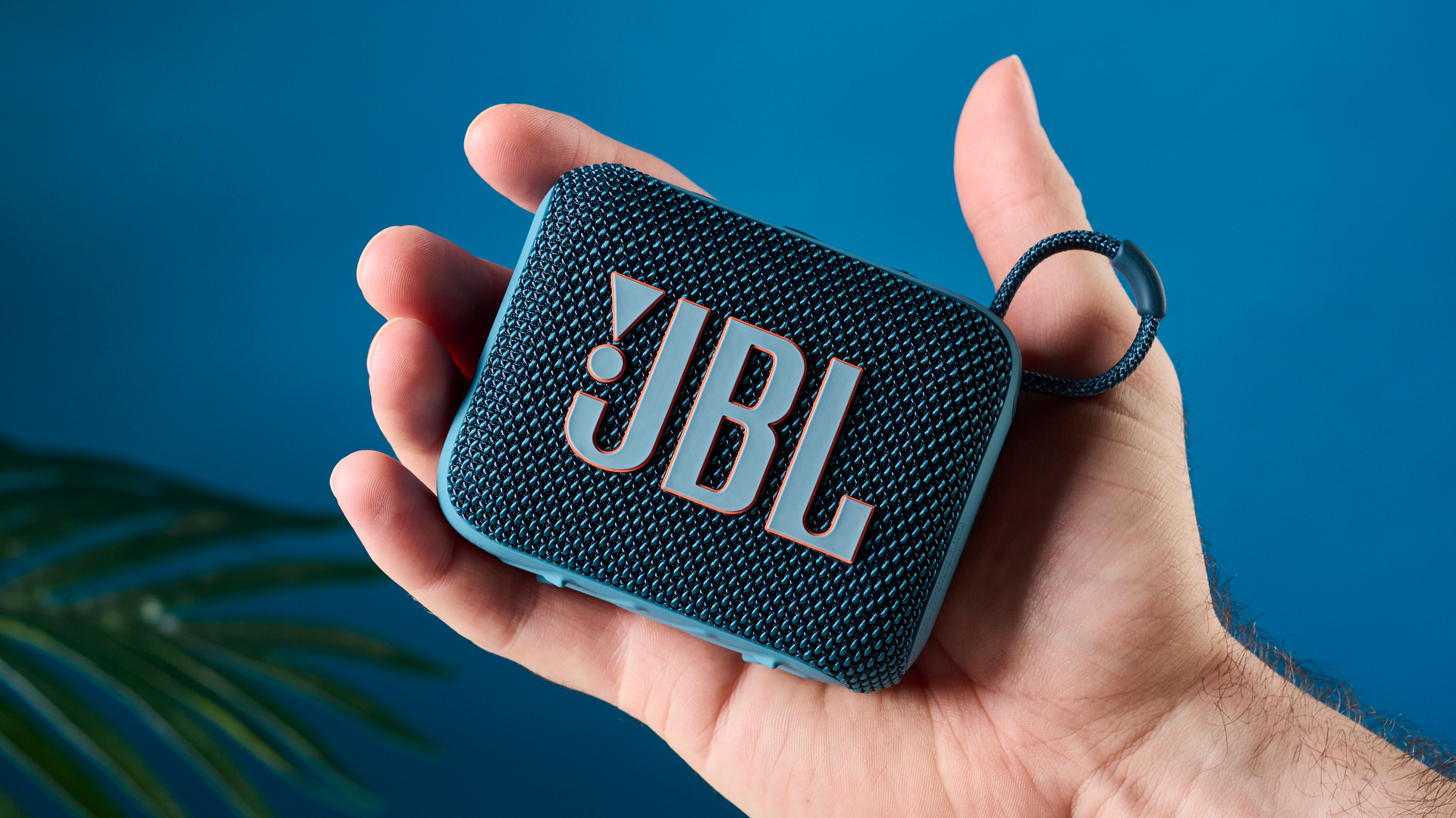 A photo of the JBL Go 4 in hand.