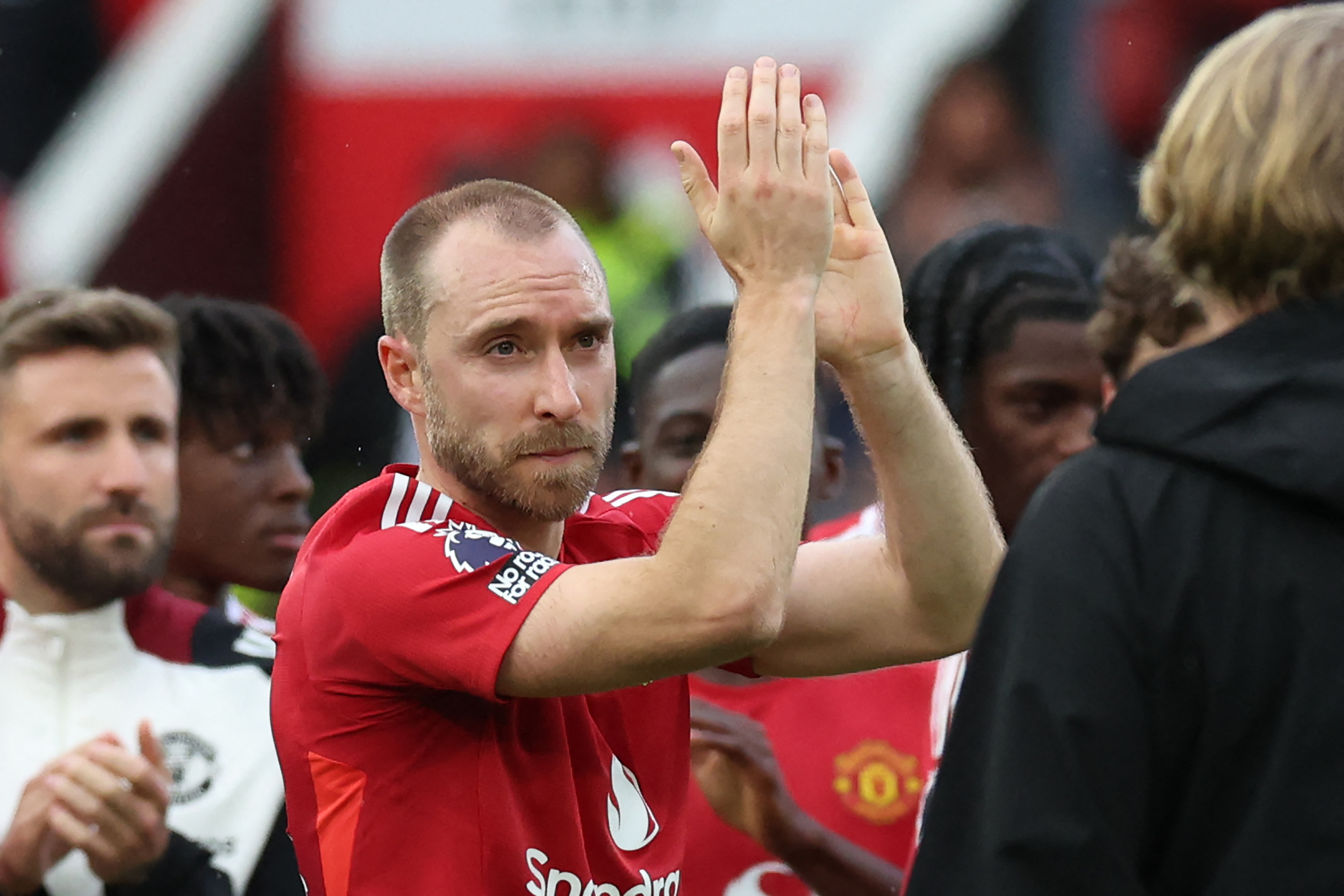 Christian Eriksen applauds the Manchester United fans after his final appearance for the club, against Aston Villa in the Premier League, in May 2025.