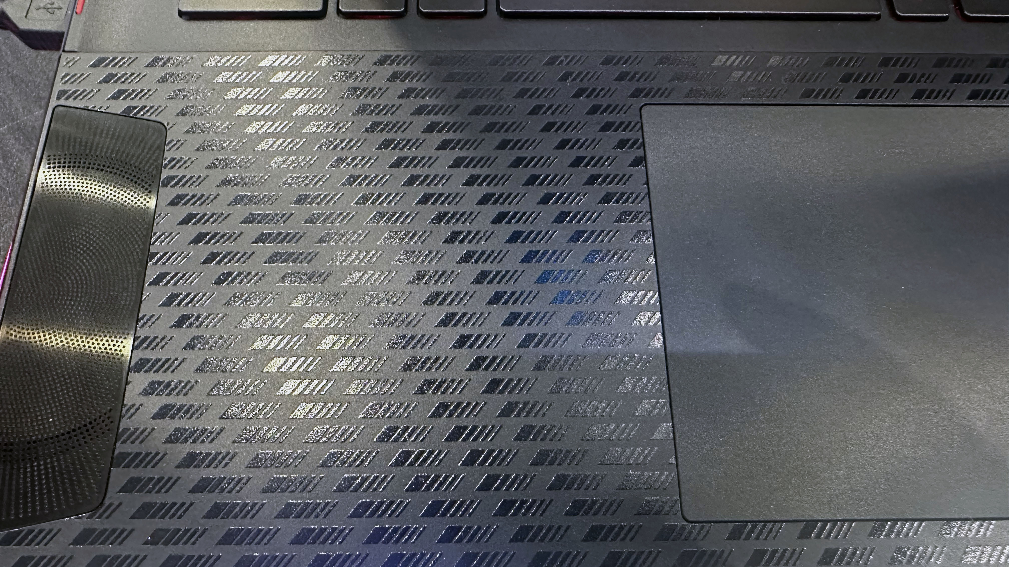 Close-up of the MSI Stealth 18 Mercedes-AMG Motorsport carbon fiber finish at Computex