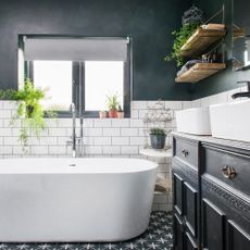 Bathroom with metro and patterned tiles and bath tub