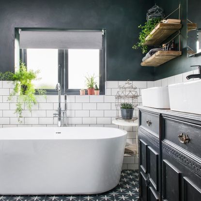 Bathroom with metro and patterned tiles and bath tub