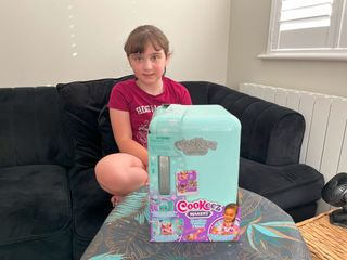 Eight year old Amelia ready to test out the Freezy Cakez fridge playset