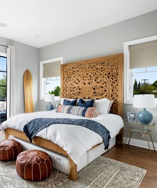 Margot Robbie’s bedroom with a wooden bedhead