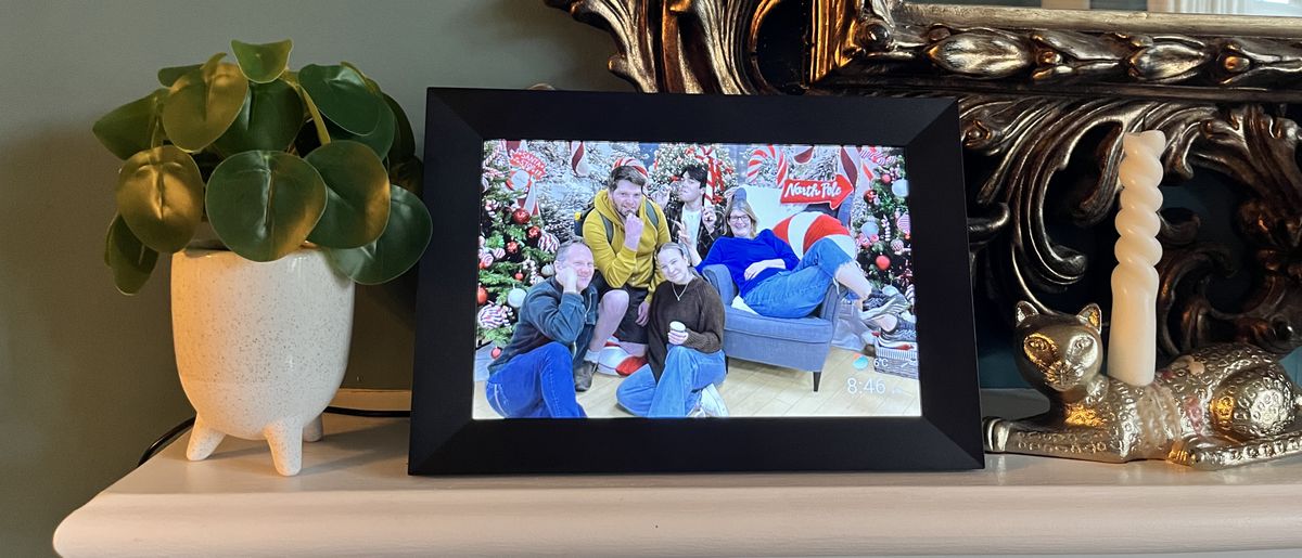 Aeezo 10.1-inch digital picture frame on mantelpiece displaying group portrait