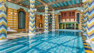 Internal shot of Talise Spa in Jumeirah Burj Al Arab, showing pool and zig-zag mosaic pillars