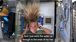 Astronaut Nyberg Demonstrates Washing Hair on the International Space Station