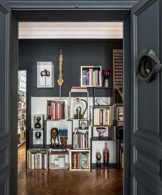 Sacha Walckhoff's Apartment with a dark academia style hallway