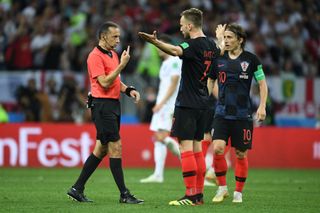 Ivan Rakitic of Croatia protests to referee Cuneyt Cakir of Turkey during the 2018 FIFA World Cup Russia Semi Final match between England and Croatia at Luzhniki Stadium on July 11, 2018 in Moscow, Russia. (Photo by Etsuo Hara/Getty Images)