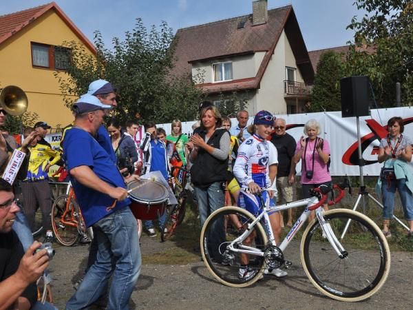 Bang that drum: the Women's winner heads up to collect her prize.