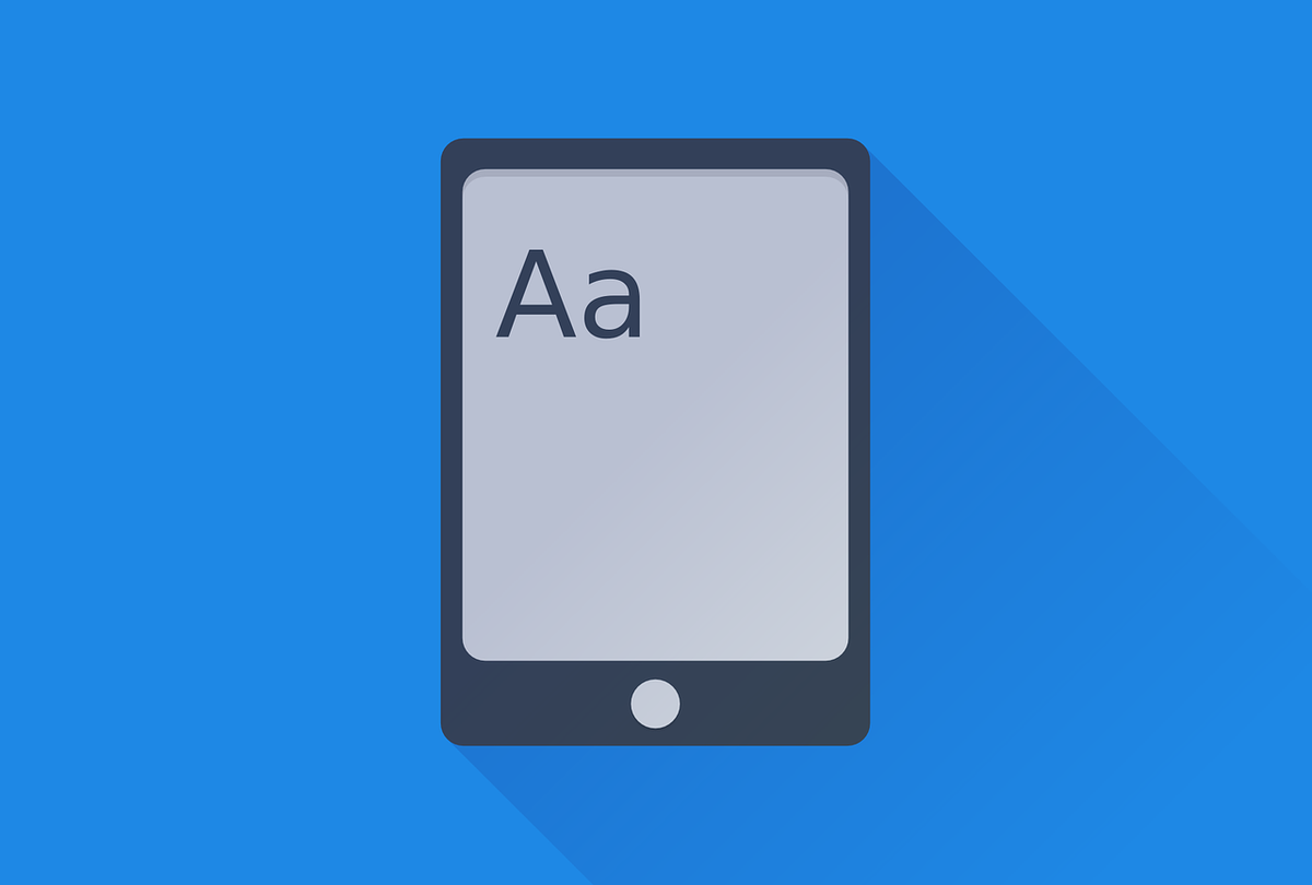 Digital leisure reading represented by an ebook reader with the letters &quot;A&quot; and &quot;a&quot; on it against a blue backdrop.