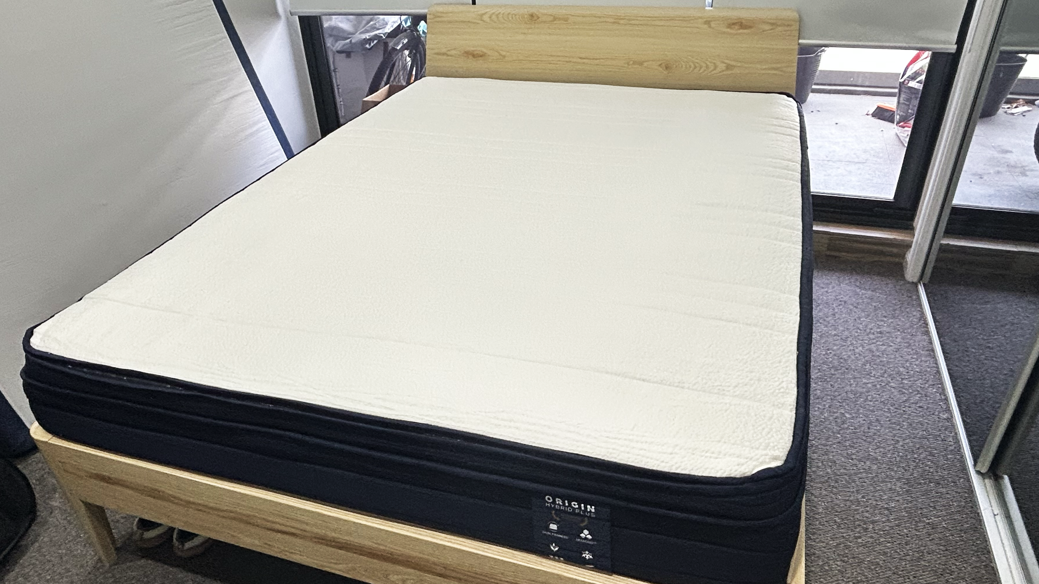 Origin Hybird Plus on wooden bed frame