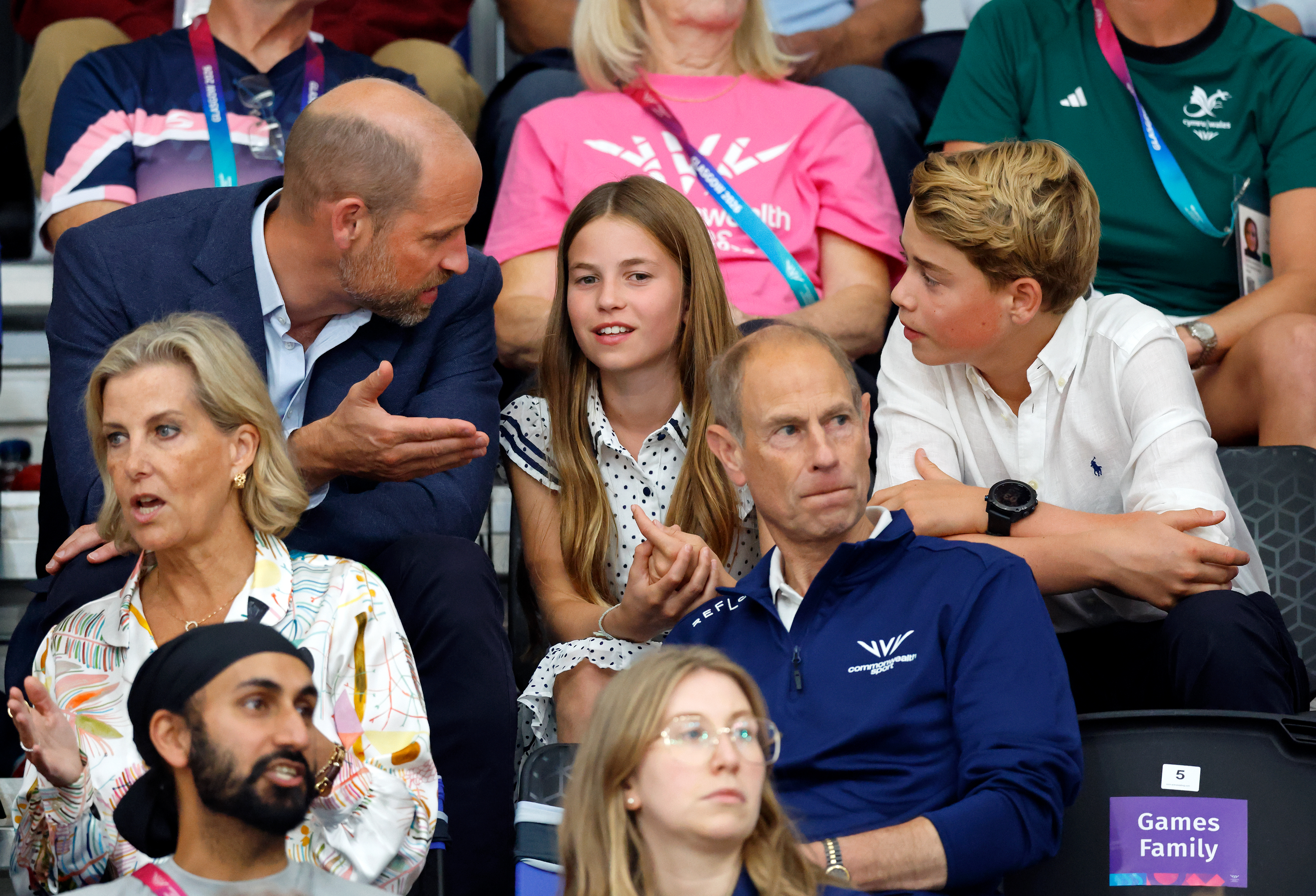 Prince William talkign to Princess Charlotte and Prince George at the Commonwealth Games
