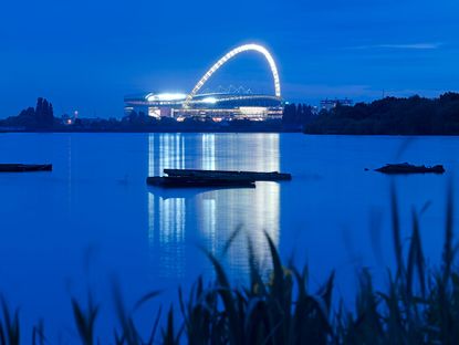 example of stadium architecture, foster and partners' wembley stadium, at night