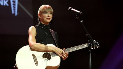 Taylor Swift on-stage at the NSAI 2022 Nashville songwriter Awards 