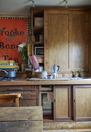 vintage wooden workbenches in kitchen with retro accessories oven