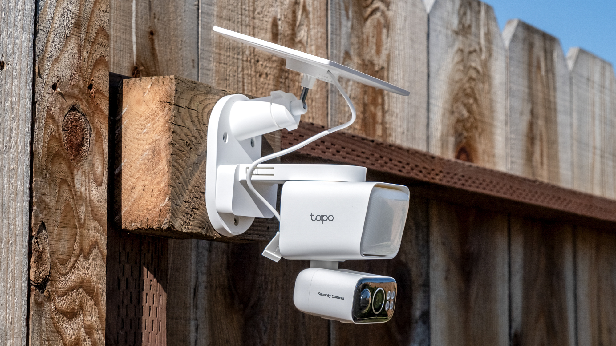 A TP Link Tapo C615F security camera mounted to a fence