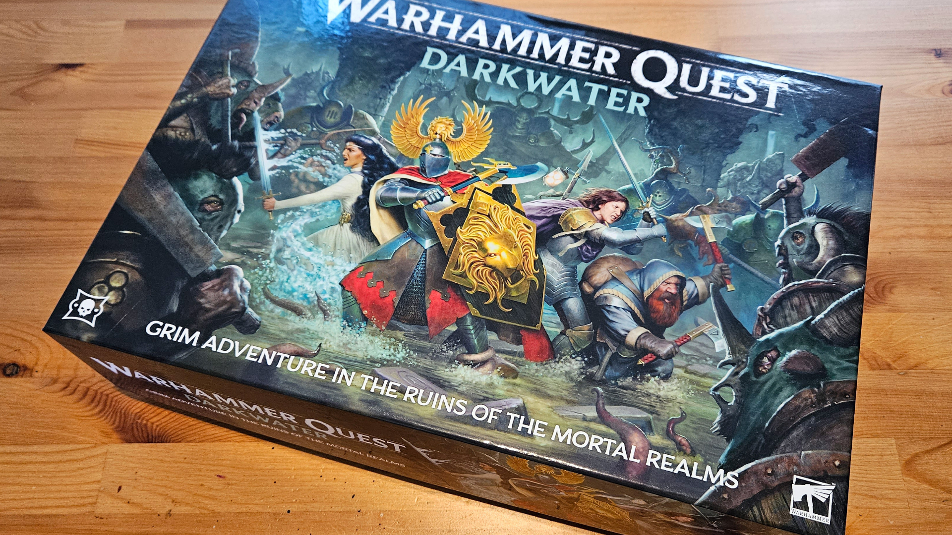 Warhammer Quest: Darkwater box on a wooden table