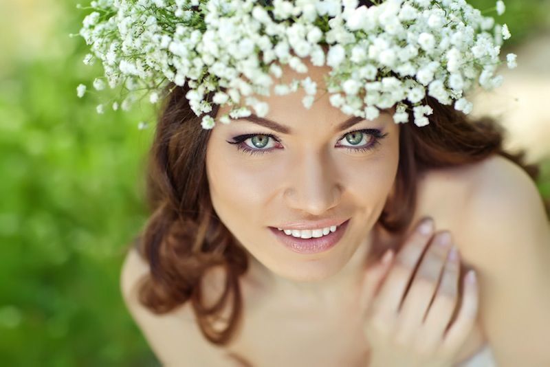 pretty woman wearing flower head crown