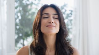 Breathing for relaxation: image shows woman breathing for relaxation
