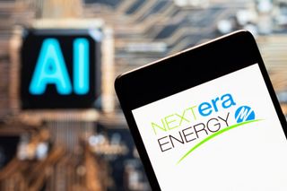 NextEra Energy logo on smartphone with blurred AI sign in the background