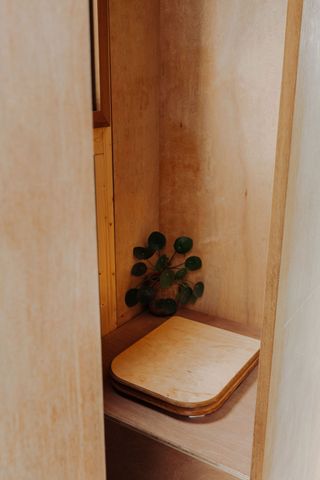 The compost toilet inside the tiny eco home