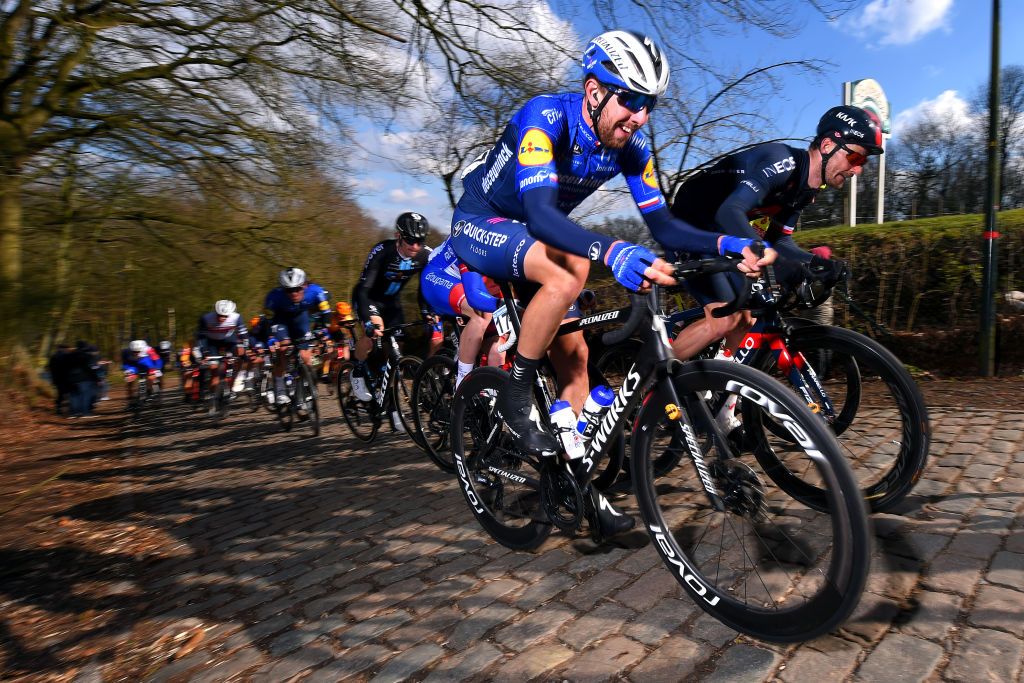 KOKSIJDE BELGIUM MARCH 19 Florian Senechal of France and Team Deceuninck QuickStep Michal Golas of Poland and Team INEOS Grenadiers during the 19th Bredene Koksijde Classic 2021 a 199km race from Bredene to Koksijde Kemmelberg Cobblestones BredeneKoksijde on March 19 2021 in Koksijde Belgium Photo by Luc ClaessenGetty Images