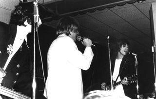 Jimmy Page (far left) performs with Keith Relf (center) and Jeff Beck (right) of the Yardbirds at Green's Pavilion in Manitou Beach, Michigan on August 10, 1966