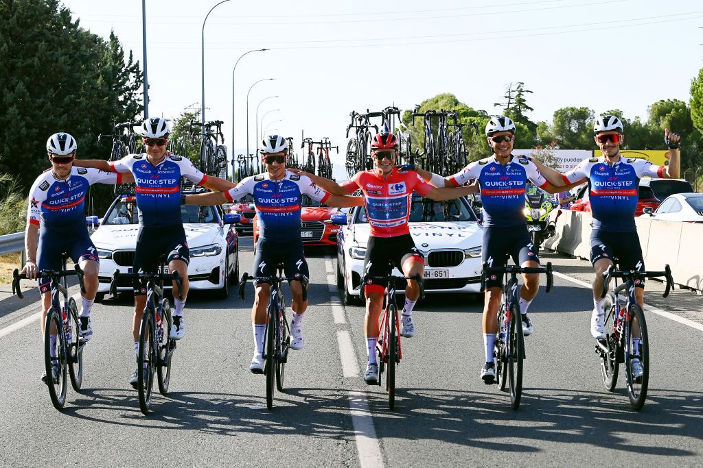 MADRID SPAIN SEPTEMBER 11 LR Rmi Cavagna of France Ilan Van Wilder of Belgium Remco Evenepoel of Belgium Red Leader Jersey Fausto Masnada of Italy Dries Devenyns of Belgium and Louis Vervaeke of Belgium and Team QuickStep Alpha Vinyl celebrateduring the 77th Tour of Spain 2022 Stage 21 a 967km stage from Las Rozas to Madrid LaVuelta22 WorldTour on September 11 2022 in Madrid Spain Photo by Tim de WaeleGetty Images