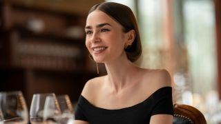 Lily Collins as Emily smiling in Emily in Paris.
