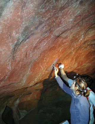 Sampling cave paintings at Tito Bustillo.