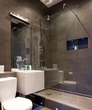 bathroom with brown tiles wall with