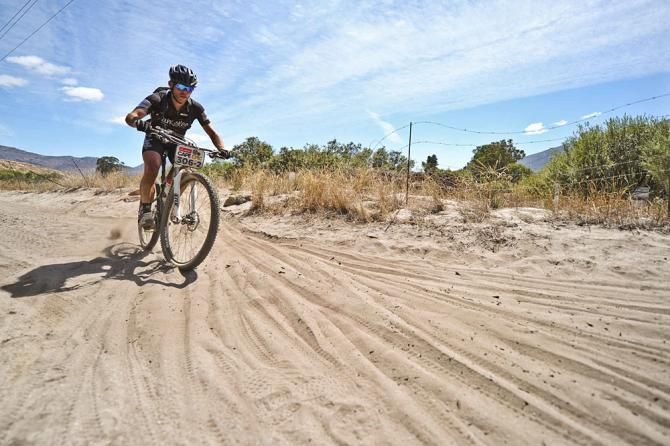 Karel De Wael of Team Cameleon Factory Racing rides through thick sand